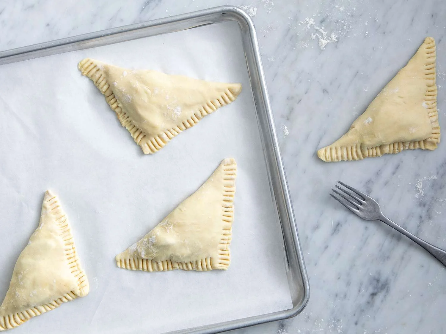 Place turnovers on a baking sheet 1 inch apart. Bake until puffed and golden, about 25 minutes. Cool.