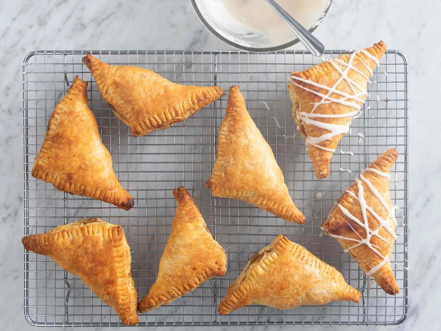 Mix confectioners' sugar, milk, and vanilla together in a small bowl. Adjust glaze consistency by adding more sugar or milk as desired;