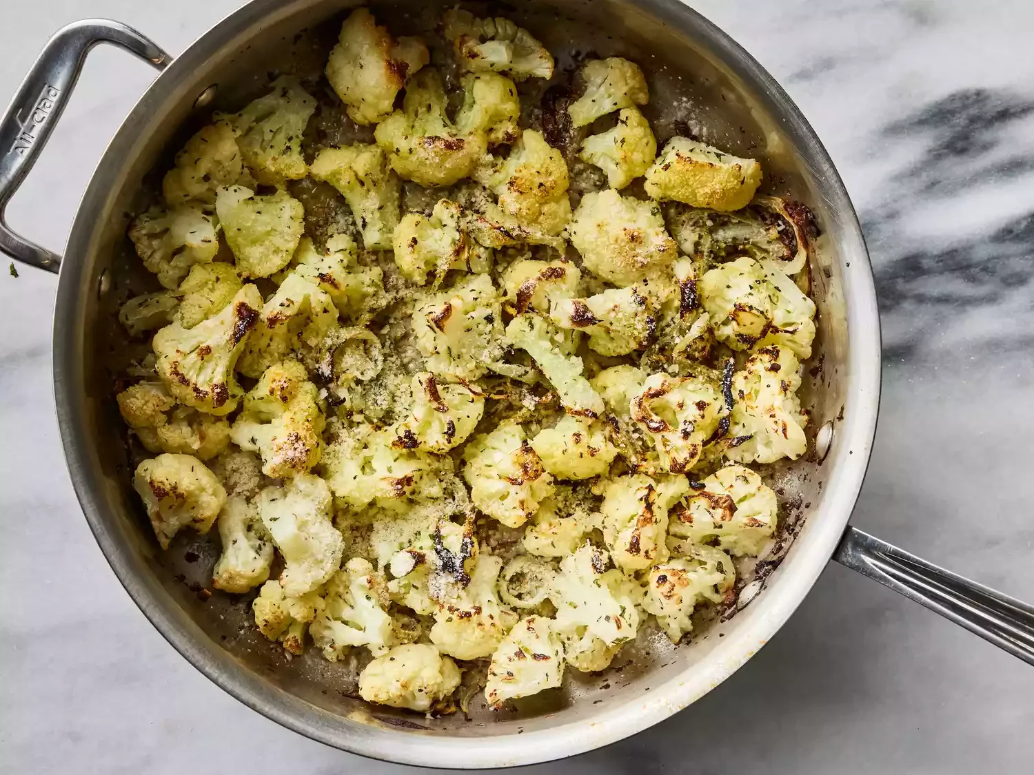Cauliflower done baking and sprinkled with parmesan cheese.